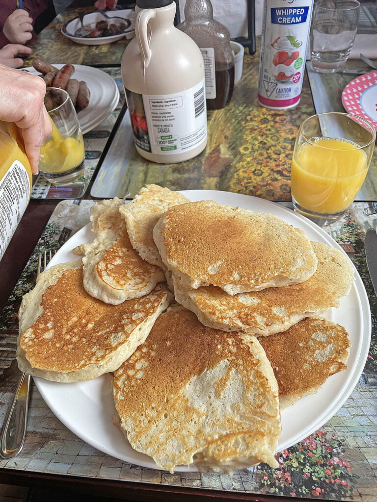 Pancakes piled on a plate.