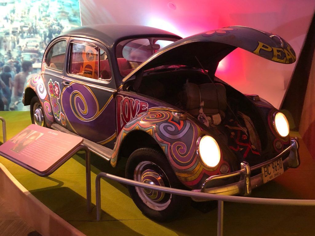 Inside the Museum at Bethel Woods, dedicated to the Woodstock Fair, is a brightly painted Volkswagen Beetle.
